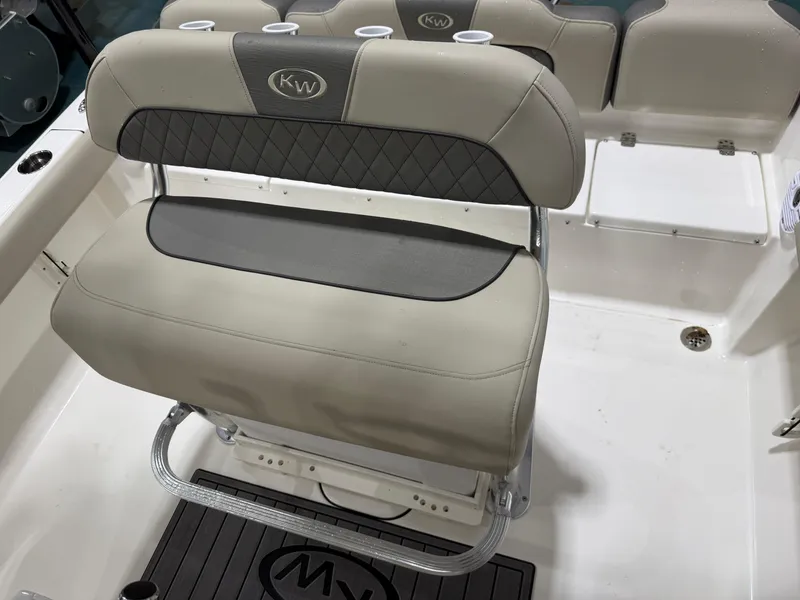 Slide: The Image of 2025 Key West 189FS boat seat with cup holders and cushioned backrest. - 22