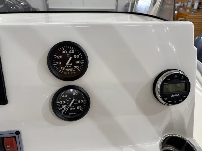 Slide: The Image of Dashboard of 2025 Key West 189FS boat with Suzuki gauges and Clarion audio system. - 27
