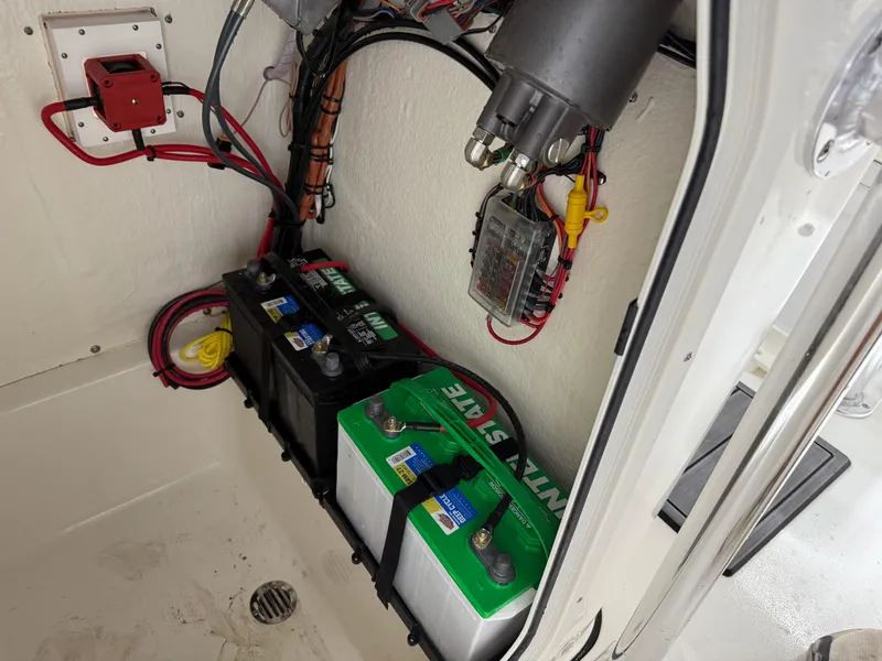 Slide: The Image of Battery compartment of 2025 Key West 189FS boat with wiring and components. - 35