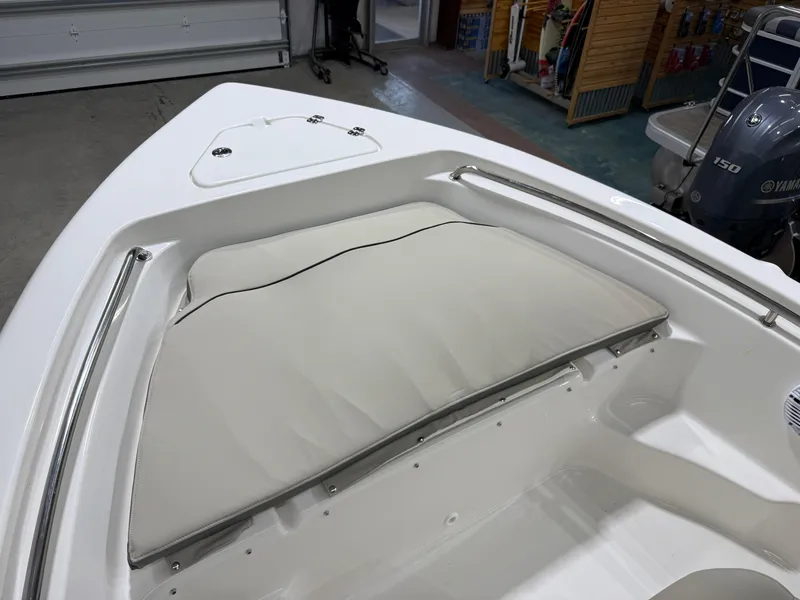 Slide: The Image of 2025 Key West 189FS boat interior with cushioned seating and Yamaha 150 engine. - 36
