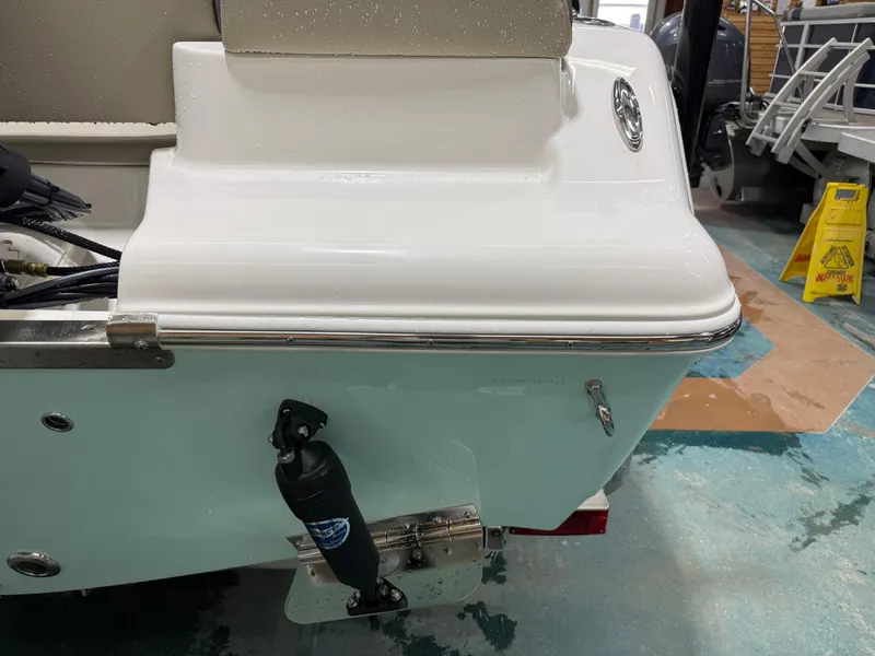Slide: The Image of 2025 Key West 189FS boat stern detail in a showroom setting. - 41