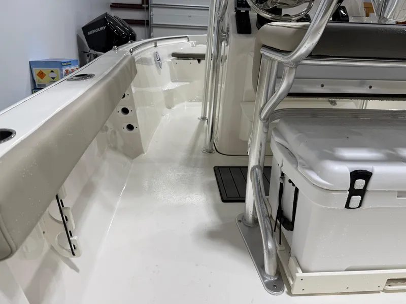 Slide: The Image of 2025 Key West 189FS boat interior with seating and storage. - 43