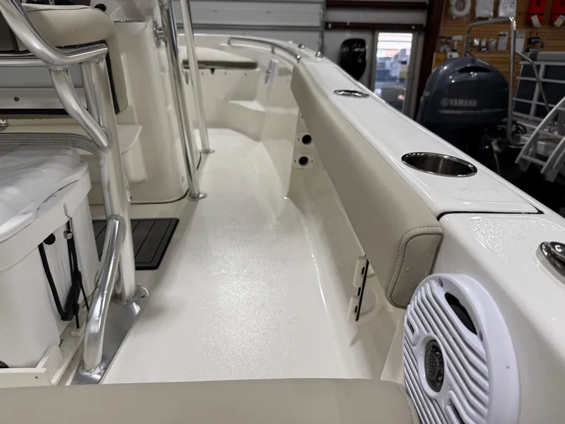Slide: The Image of 2025 Key West 189FS boat interior with seating and cup holders. - 44