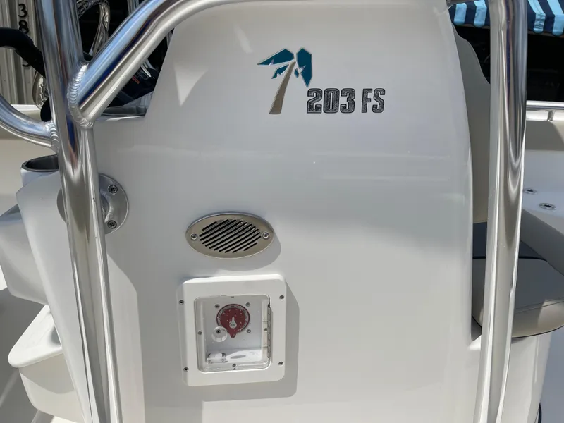 Slide: The Image of Close-up of 2025 Key West 203FS boat console with speaker and control panel. - 10