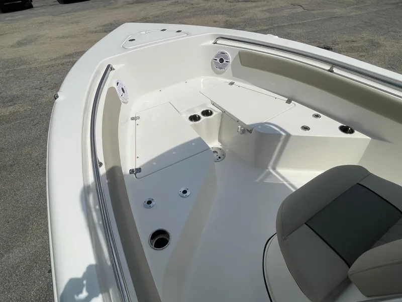 Slide: The Image of 2025 Key West 203FS boat interior with seating and storage compartments. - 15