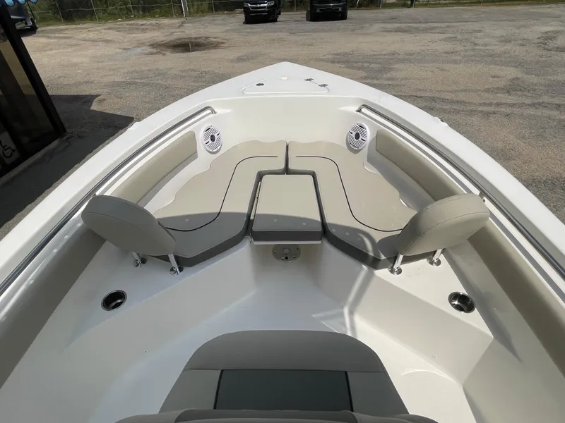 Slide: The Image of 2025 Key West 203FS boat interior with seating and speakers. - 16