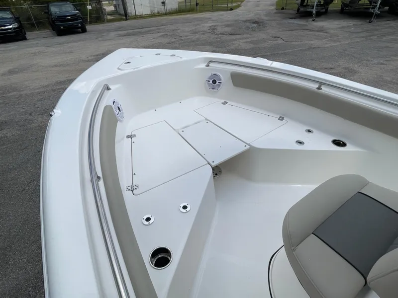 Slide: The Image of 2025 Key West 203FS boat interior with seating and storage compartments. - 21