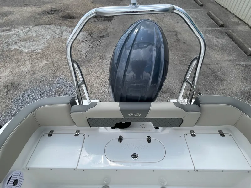 Slide: The Image of Key West 203FS 2025 boat with sleek design and powerful engine. - 23