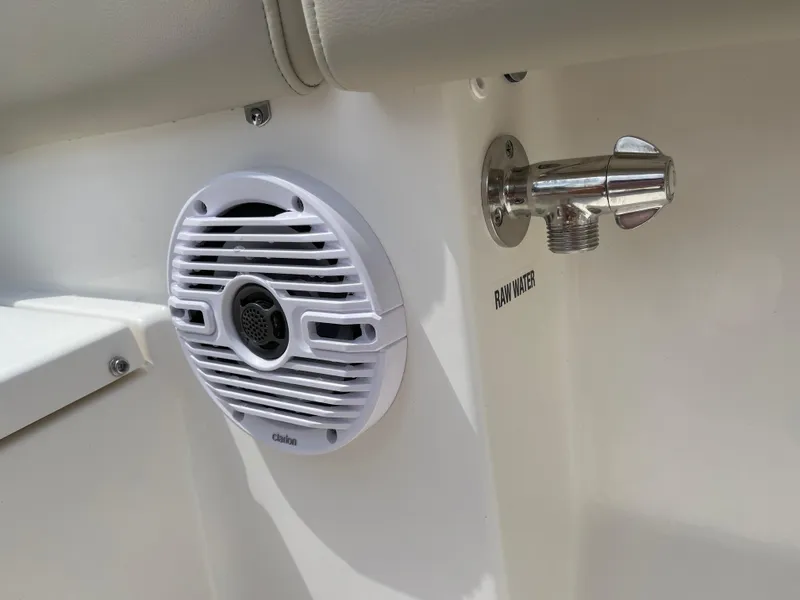 Slide: The Image of 2025 Key West 203FS boat speaker and raw water outlet detail. - 25