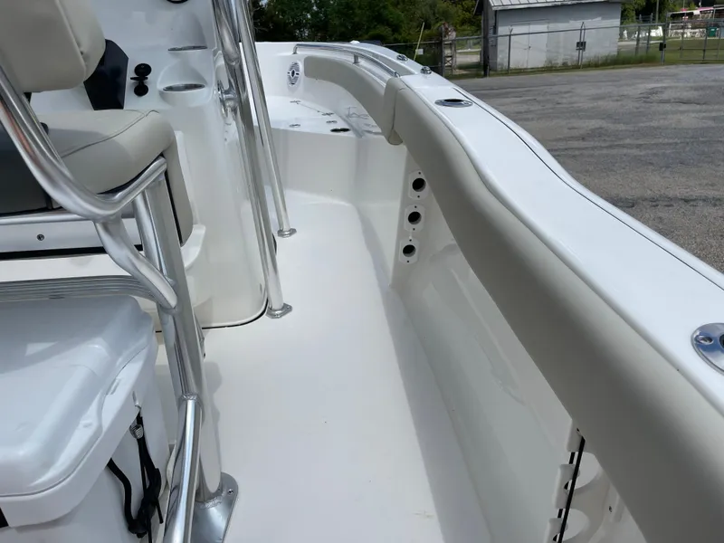 Slide: The Image of 2025 Key West 203FS boat interior with seating and railing. - 33