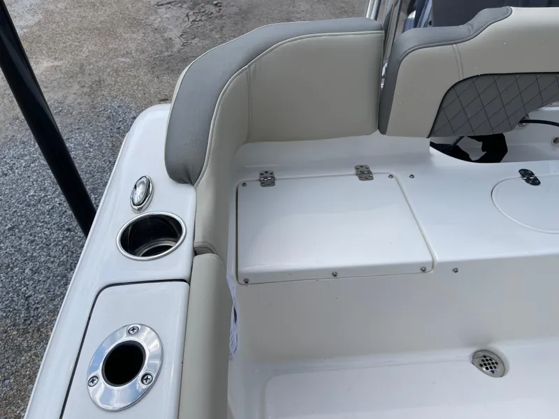 Slide: The Image of 2025 Key West 203FS boat interior with cup holders and seating. - 36