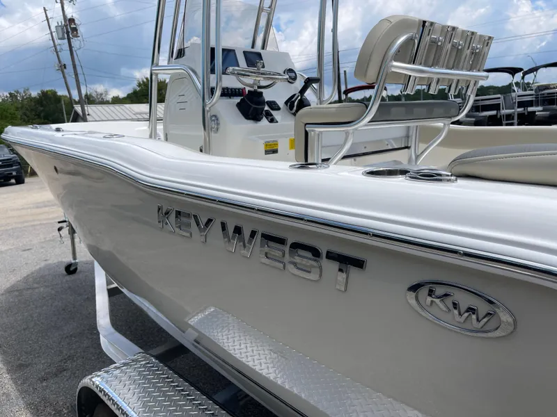 Slide: The Image of 2025 Key West 203FS boat, sleek design, white exterior, modern console, and seating. - 40
