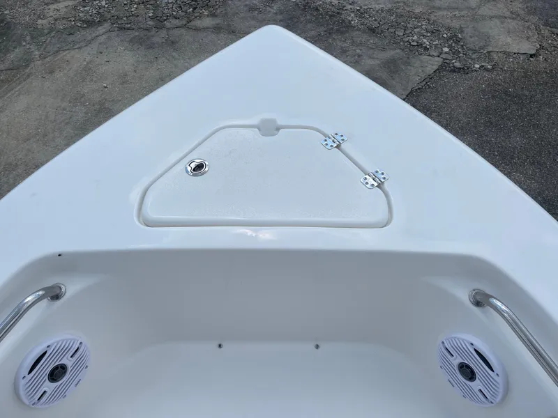 Slide: The Image of Bow of 2025 Key West 203FS boat with storage hatch and speakers. - 41