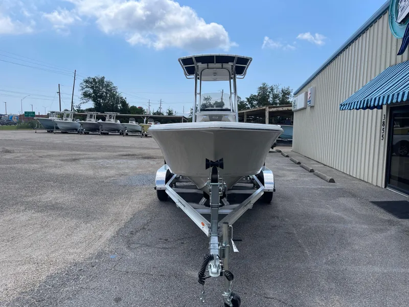 Slide: The Image of 2025 Key West 203FS boat on trailer in parking lot, clear sky background. - 5