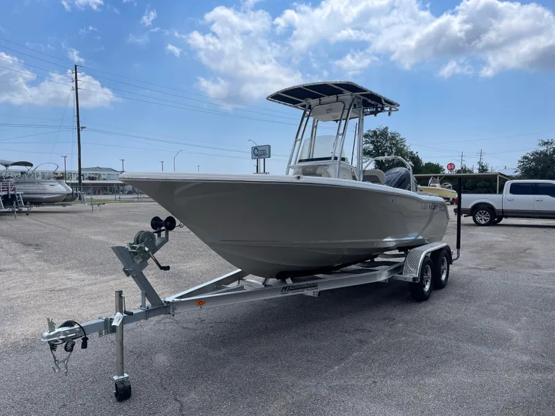Slide: The Image of 2025 Key West 203FS boat on trailer under blue sky. - 6