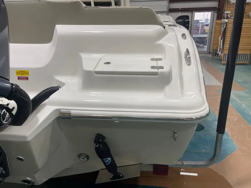 Slide: The Image of 2025 Key West 219fs boat stern view in showroom. - 11
