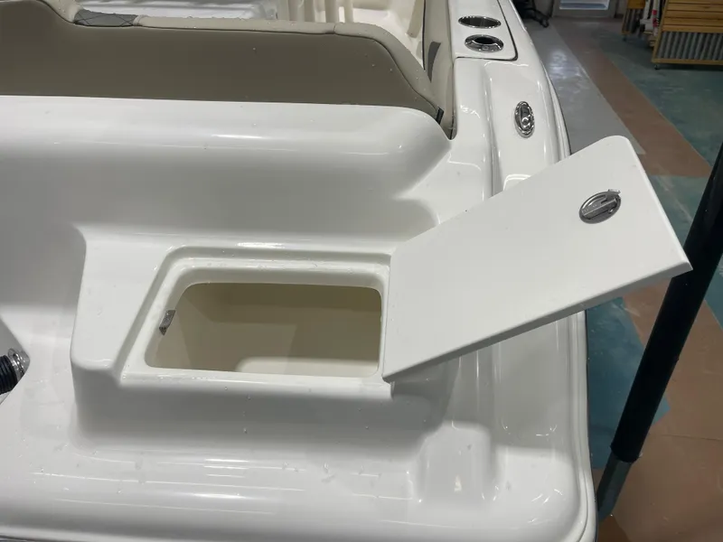 Slide: The Image of 2025 Key West 219fs boat storage compartment with open lid. - 13