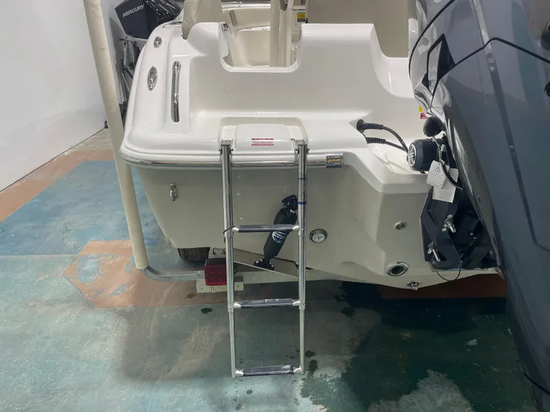 Slide: The Image of 2025 Key West 219fs boat with ladder and motor detail. - 14