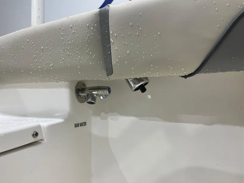 Slide: The Image of 2025 Key West 219fs boat with raw water outlet detail. - 17