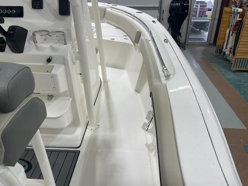 Slide: The Image of 2025 Key West 219fs boat interior with sleek white design and modern controls. - 20