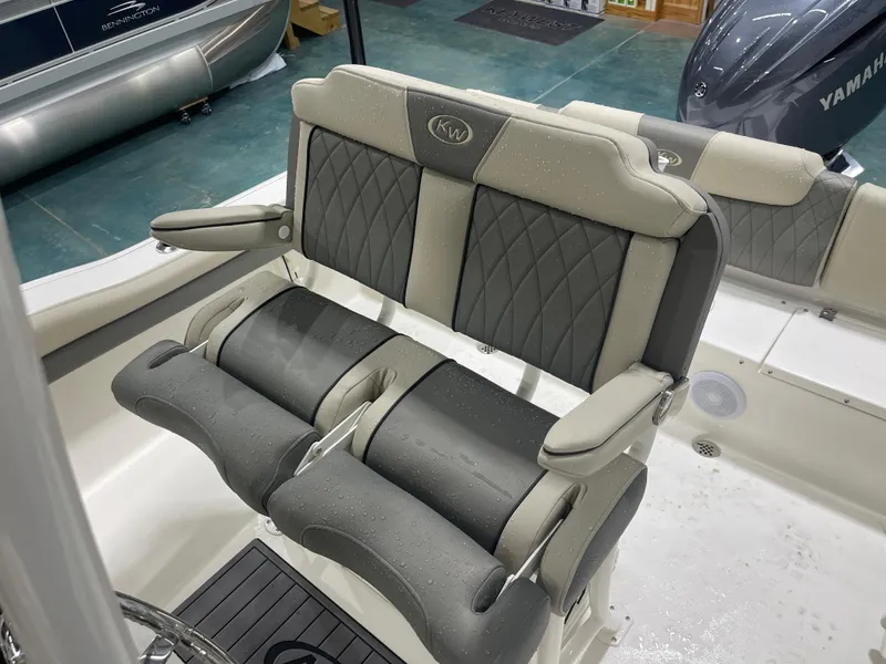Slide: The Image of 2025 Key West 219fs boat seats with diamond stitching and armrests, featuring Yamaha engine. - 24