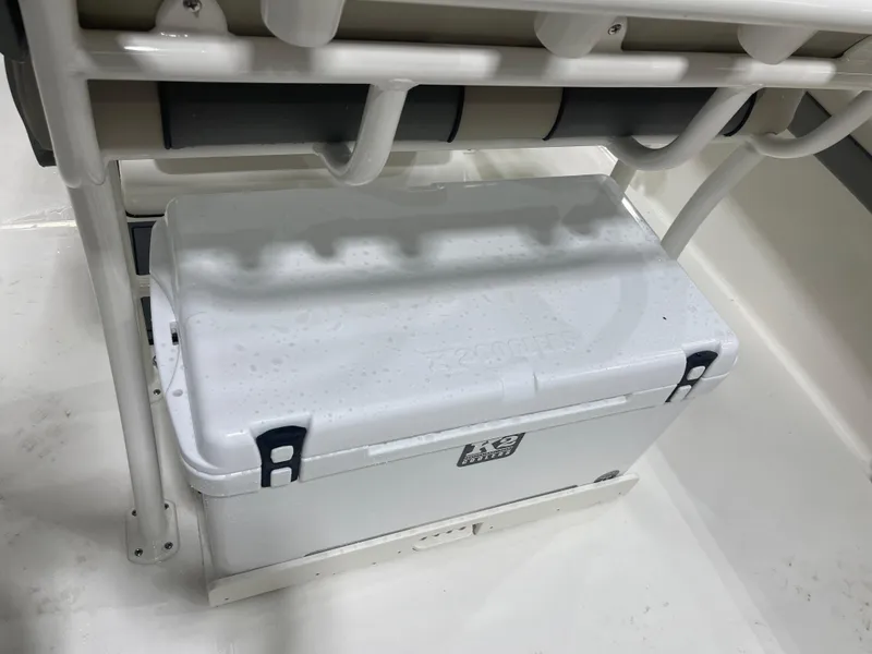 Slide: The Image of White cooler on 2025 Key West 219fs boat, secured under seat. - 25