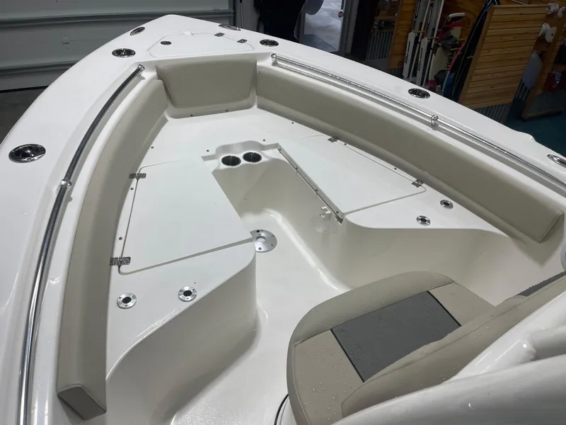 Slide: The Image of 2025 Key West 219fs boat interior with seating and storage compartments. - 32