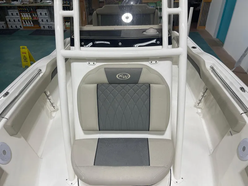 Slide: The Image of 2025 Key West 219fs boat interior with cushioned seating and sleek design. - 37