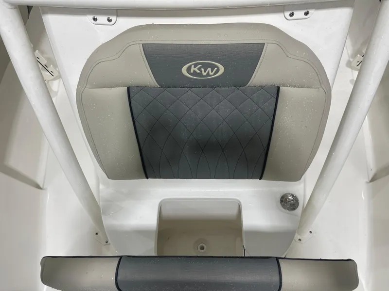 Slide: The Image of 2025 Key West 219fs boat seat with KW logo, featuring gray and beige upholstery. - 38