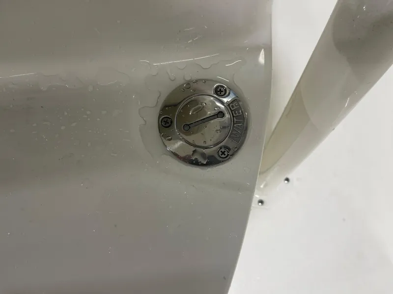 Slide: The Image of Water inlet on 2025 Key West 219fs boat, close-up view. - 39