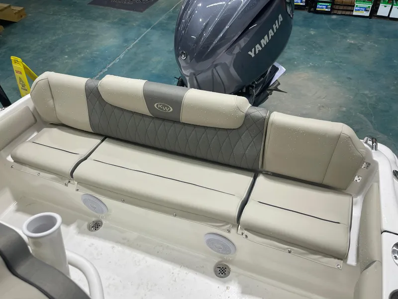 Slide: The Image of 2025 Key West 219fs boat interior with Yamaha engine, featuring cushioned seating. - 43