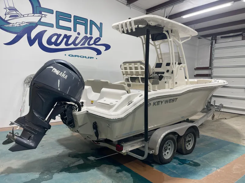 Slide: The Image of 2025 Key West 219fs boat with Yamaha engine in showroom. - 5