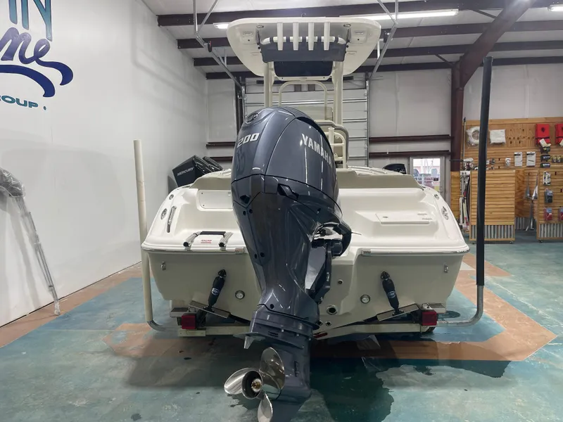 Slide: The Image of 2025 Key West 219fs boat with Yamaha 200 engine in showroom. - 6