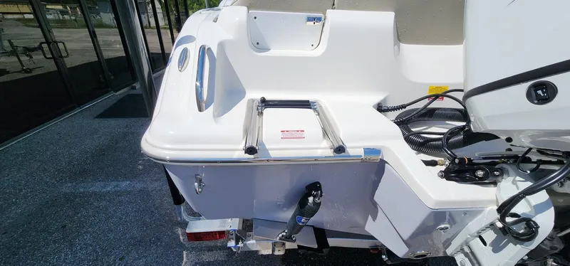 Slide: The Image of 2024 Key West 219fs boat stern with ladder and motor details. - 16