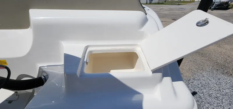 Slide: The Image of 2024 Key West 219fs boat storage compartment with open hatch. - 18