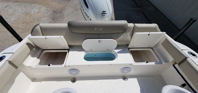 Slide: The Image of 2024 Key West 219fs boat interior with storage compartments and seating. - 22