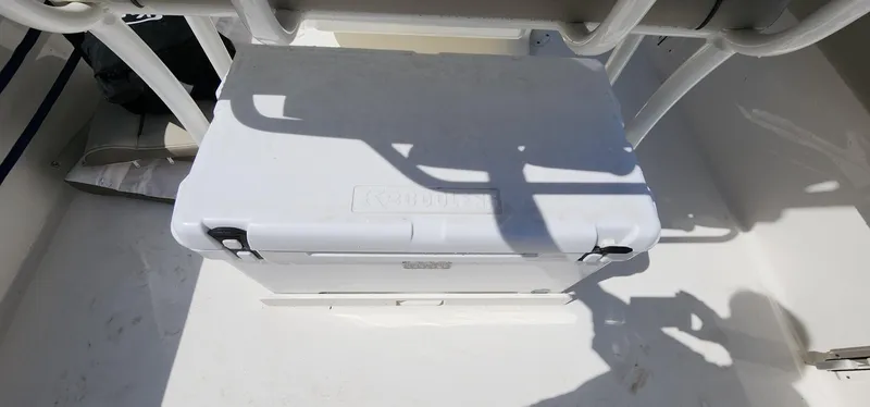 Slide: The Image of White cooler on 2024 Key West 219fs boat deck, under rod holders. - 26