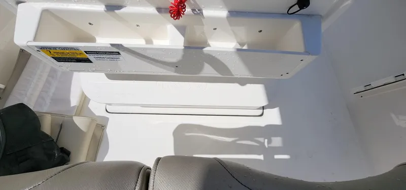 Slide: The Image of 2024 Key West 219fs boat interior with storage compartment and seating. - 29