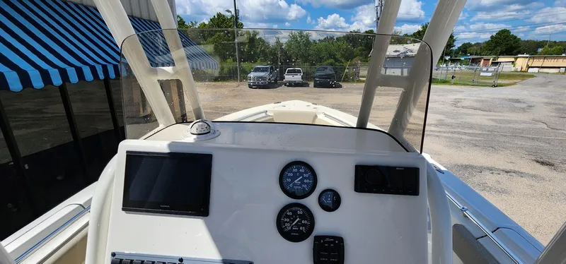 Slide: The Image of 2024 Key West 219fs boat dashboard with gauges and navigation screen. - 31