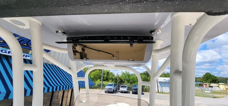 Slide: The Image of 2024 Key West 219fs boat interior with T-top and electronics. - 33