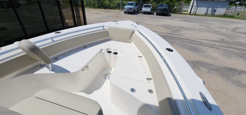 Slide: The Image of 2024 Key West 219fs boat interior with seating and storage compartments. - 34