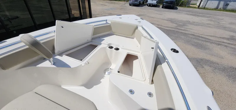 Slide: The Image of 2024 Key West 219fs boat interior with open storage compartments and seating. - 35