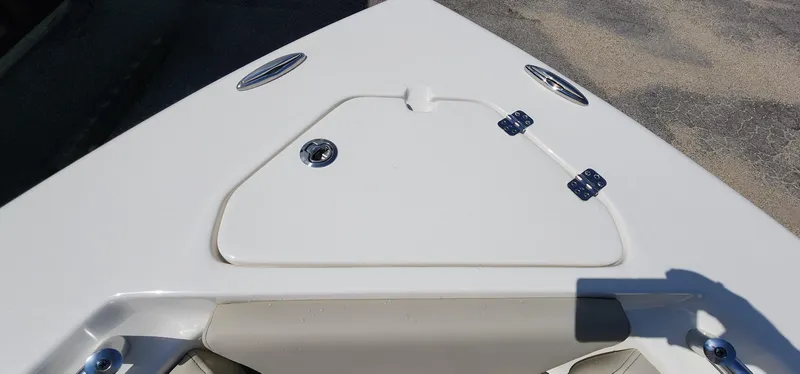 Slide: The Image of 2024 Key West 219fs boat bow with storage compartment and stainless steel fittings. - 36