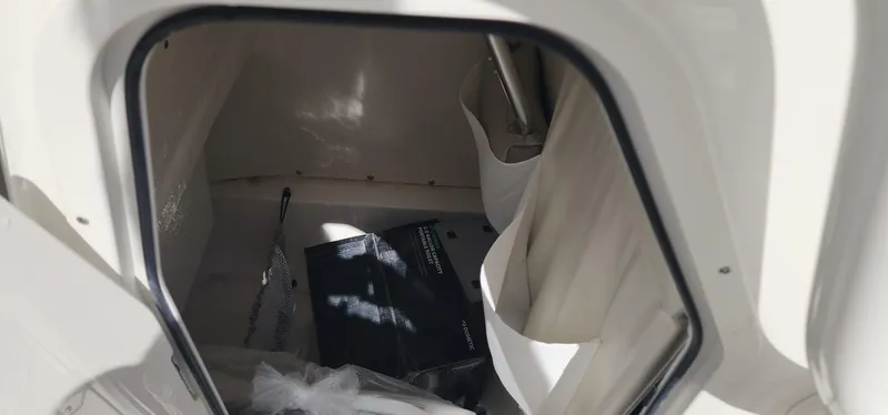 Slide: The Image of 2024 Key West 219fs boat storage compartment with accessories. - 38