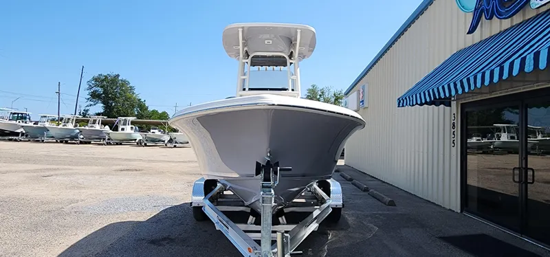 Slide: The Image of 2024 Key West 219fs boat on trailer outside dealership. - 6