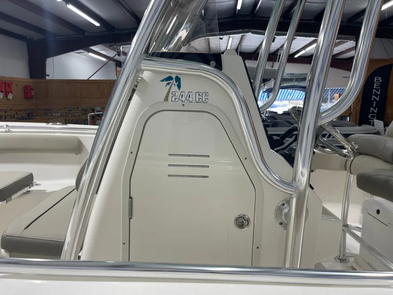 Slide: The Image of 2024 Key West 244CC boat interior with seating and console details. - 11