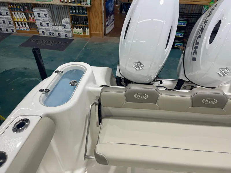 Slide: The Image of 2024 Key West 244CC boat with dual Suzuki engines and comfortable seating. - 17