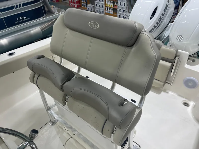 Slide: The Image of 2024 Key West 244CC boat seating with dual Suzuki outboard motors. - 20