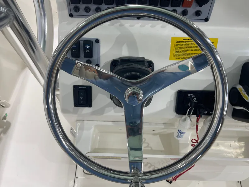 Slide: The Image of 2024 Key West 244CC boat steering wheel and control panel. - 25