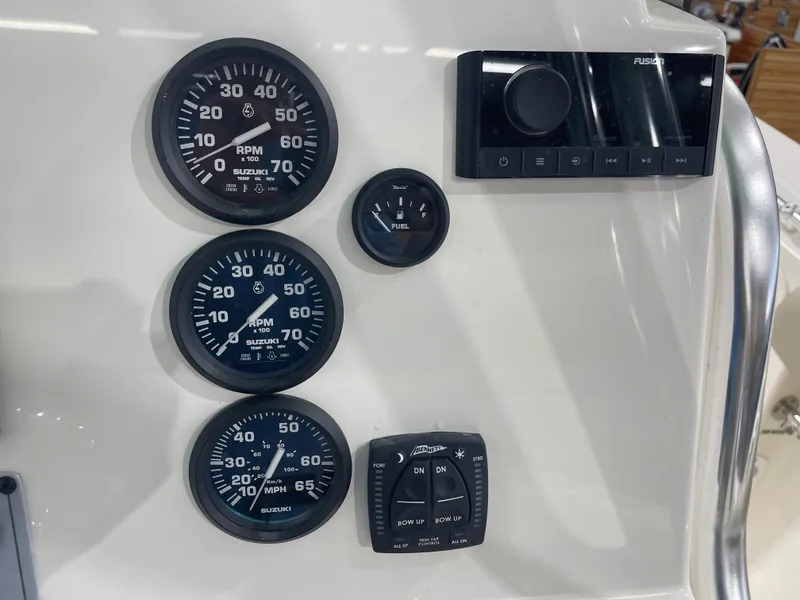 Slide: The Image of Dashboard of 2024 Key West 244CC boat with gauges and controls. - 28